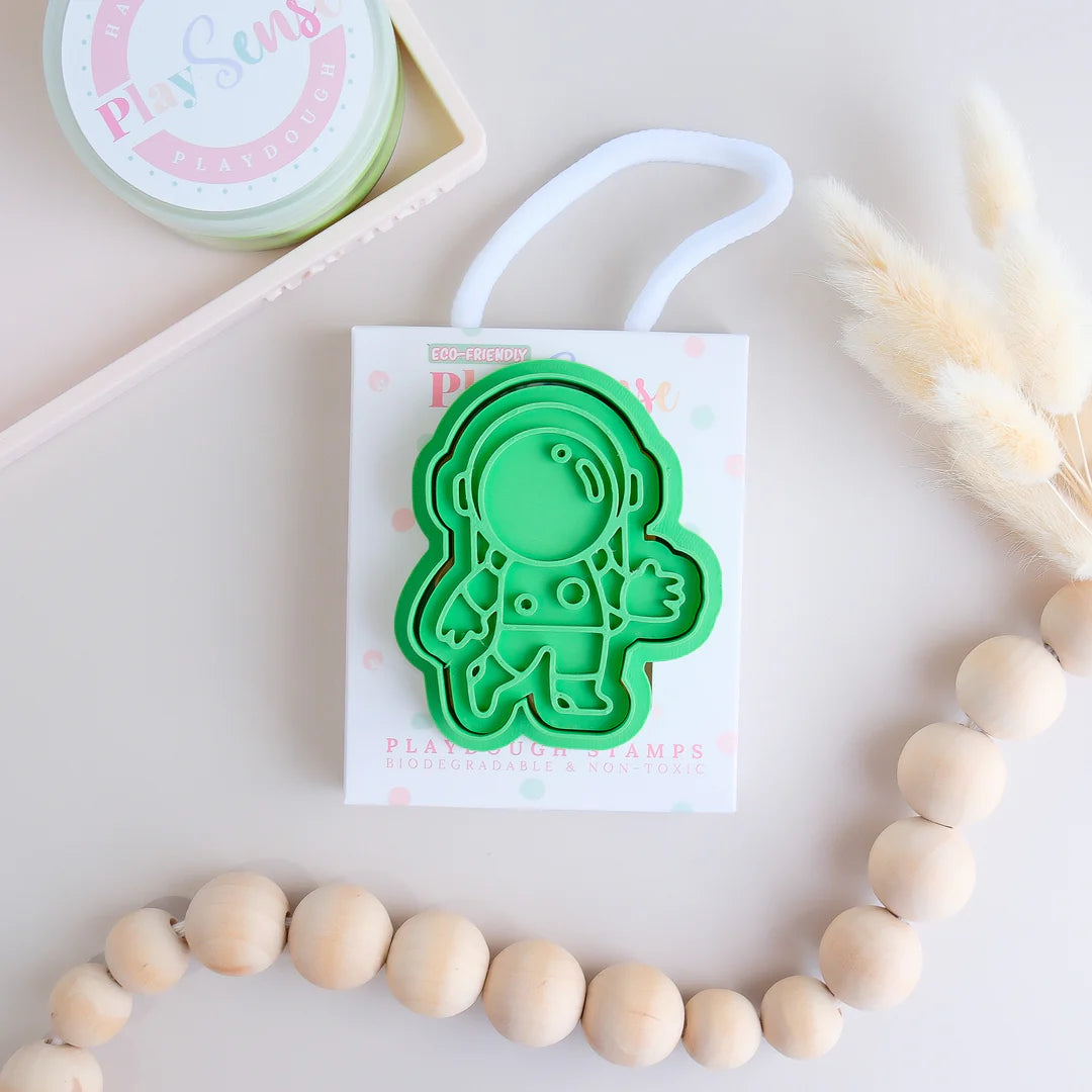 photoshoot image of stock image of playdoughc/clay stamp and cutter. Eco-friendly sensory play tool perfect for creative and imaginative play. can also be used for cookies and baking. pictured is astronaut