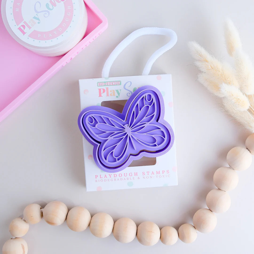 photoshoot of  of playdoughc/clay stamp and cutter. Eco-friendly sensory play tool perfect for creative and imaginative play. can also be used for cookies and baking. pictured is butterfly