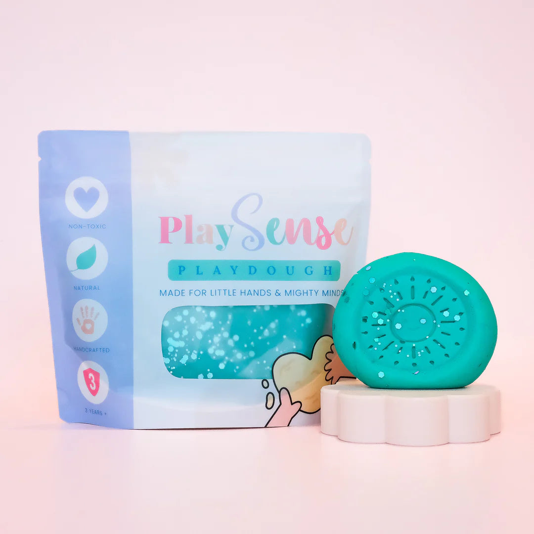 Image of dough by the brand playsense. Great for sensory play and being creative, also fine motor development. Dough is non toxic with all natural ingredients so safe for little hands. Colour and scent glitter teal sour lolly