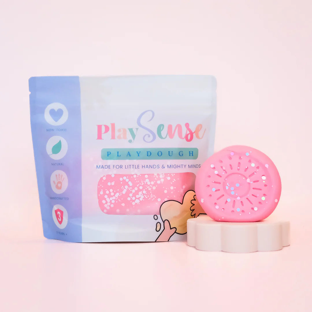 Image of dough by the brand playsense. Great for sensory play and being creative, also fine motor development. Dough is non toxic with all natural ingredients so safe for little hands. Colour and scent is Glitter Pastel Pink Cotton Candy 