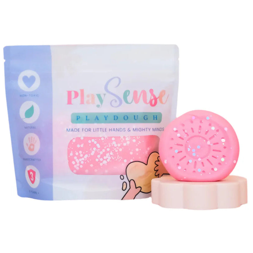 Image of dough by the brand playsense. Great for sensory play and being creative, also fine motor development. Dough is non toxic with all natural ingredients so safe for little hands. Colour and scent is Glitter Pastel Pink Cotton Candy 