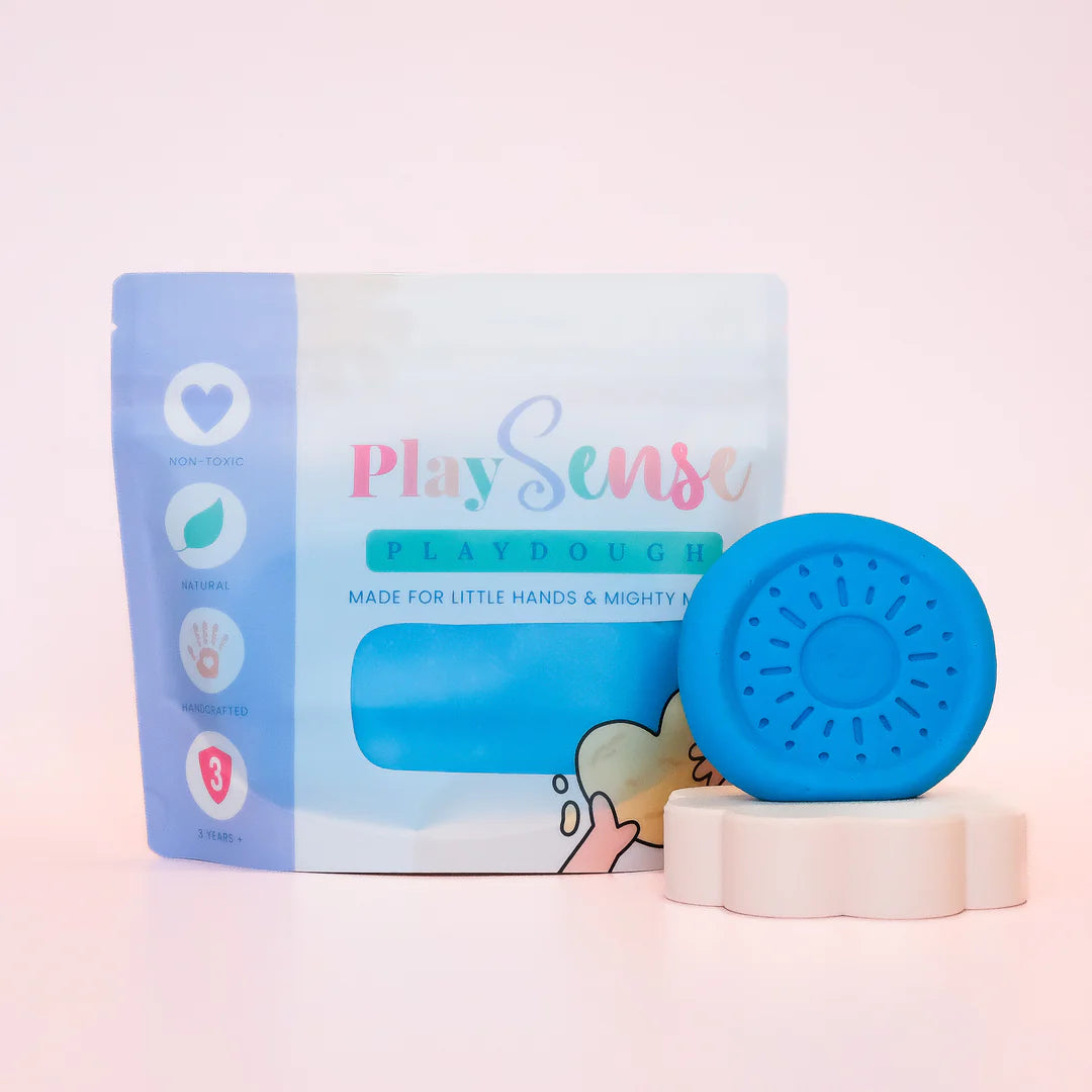 photoshoot Image of dough by the brand playsense. Great for sensory play and being creative, also fine motor development. Dough is non toxic with all natural ingredients so safe for little hands. Colour and scent is blue and blue slushy