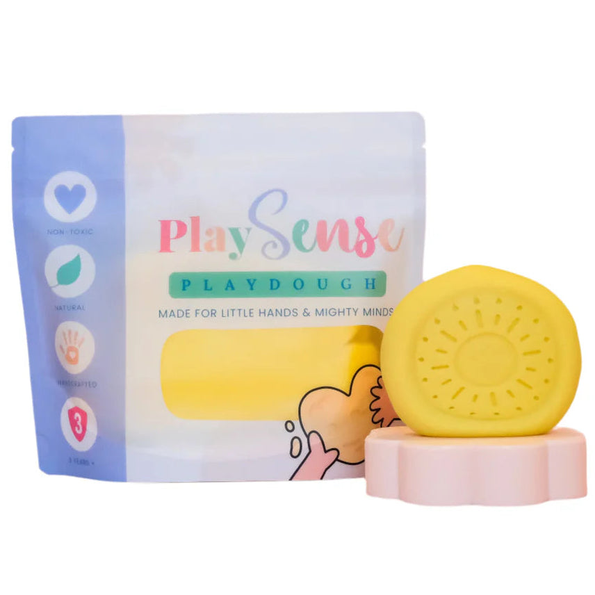 Image of dough by the brand playsense. Great for sensory play and being creative, also fine motor development. Dough is non toxic with all natural ingredients so safe for little hands. Colour and scent is Pastel Yellow Banana Paddlepop