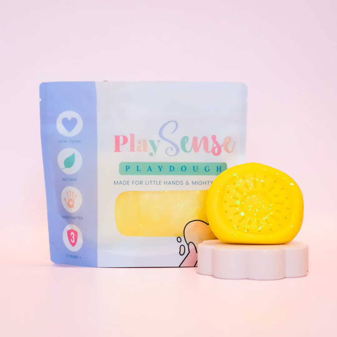 Image of dough by the brand playsense. Great for sensory play and being creative, also fine motor development. Dough is non toxic with all natural ingredients so safe for little hands. Colour and scent is glitter yellow banana paddlepop