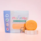 Image of dough by the brand playsense. Great for sensory play and being creative, also fine motor development. Dough is non toxic with all natural ingredients so safe for little hands. Colour and scent is Pastel Peach Fruit Salad