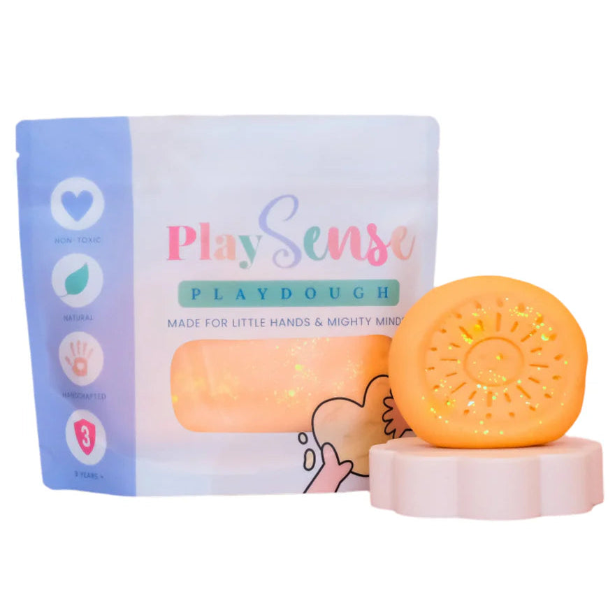 Image of dough by the brand playsense. Great for sensory play and being creative, also fine motor development. Dough is non toxic with all natural ingredients so safe for little hands. Colour and scent glitter peach fruit salad