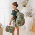 child wearing the Fox & Fallow backpack for kids, perfect for school, daycare and everyday use. Spacious, practical and designed for little adventures. Personalisation of embroidery with name also available on bags in 2 placements. This print is dinos with matching lunch bag