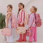 friends photoshoot of modelling the Fox & Fallow backpack for kids, perfect for school, daycare and everyday use. Spacious, practical and designed for little adventures. Personalisation of embroidery with name also available on bags in 2 placements. This print is dusty roses, daisy chains and burgundy stripes. all have matching lunch bags