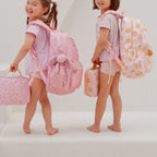 modelling the Fox & Fallow backpack for kids, perfect for school, daycare and everyday use. Spacious, practical and designed for little adventures. Personalisation of embroidery with name also available on bags in 2 placements. This print is dusty roses and daisy chains