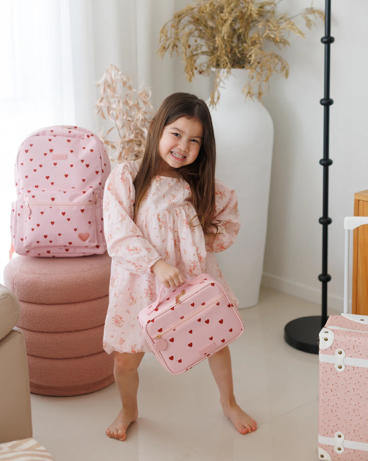 girl photoshoot Fox & Fallow little hearts backpack front view kids school bag