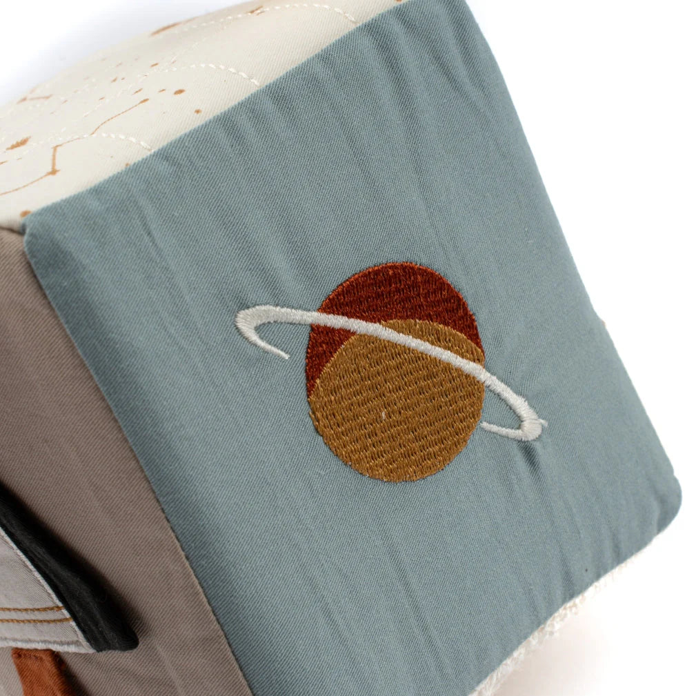 Soft educational baby toy with space-inspired fabric panels