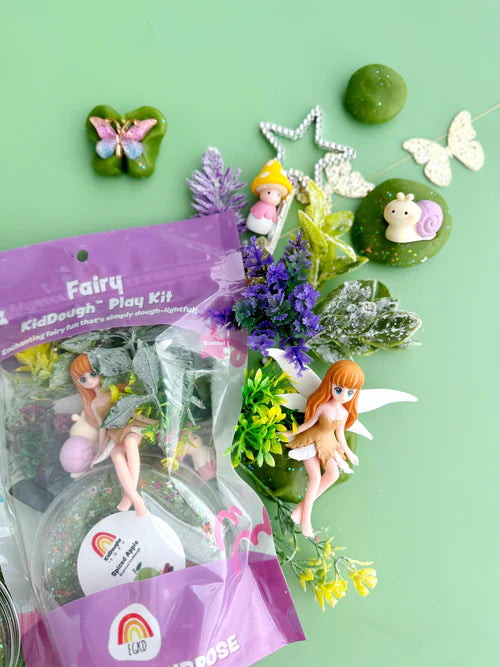Fairy sensory play kit with butterfly charms, flowers, plants and soft playdough designed for tactile exploration and fine motor development