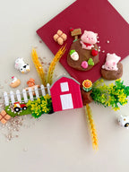 Kids farm playdough sensory kit with pigs, barn toy, fence pieces and small world farm accessories displayed on a neutral background
