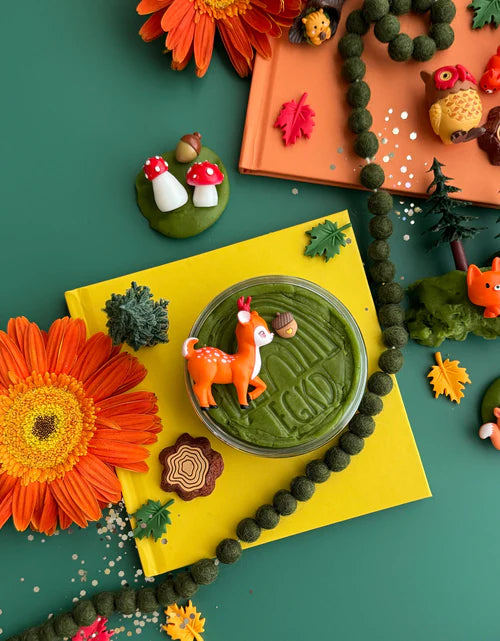 Kids forest playdough kit with animal charms, trees, flowers and sensory dough displayed for creative storytelling and fine motor development