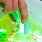 Jellystone Designs green light up bath cubes for sensory exploration
