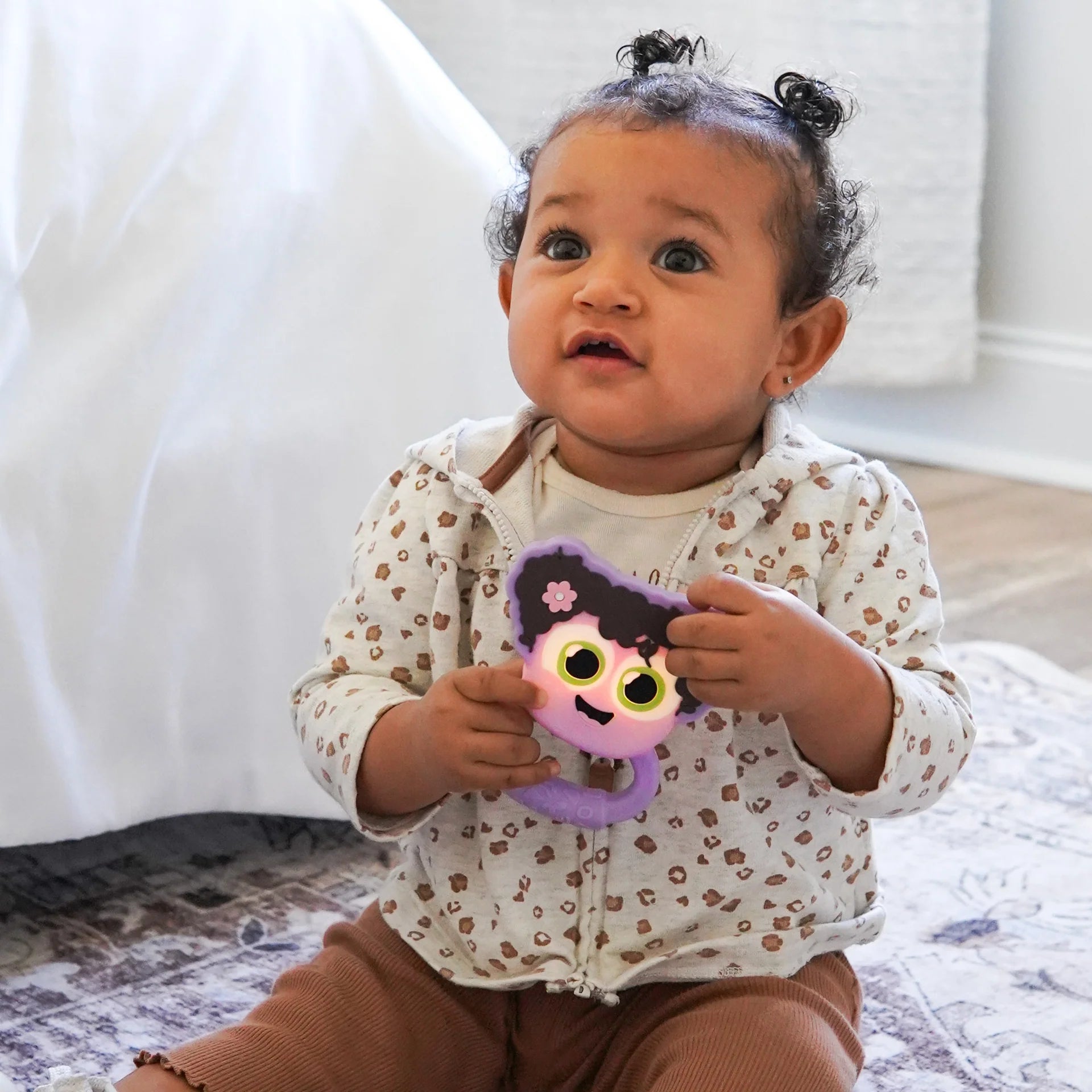 Jellystone Designs purple baby rattle with tactile textures for sensory play and tummy time