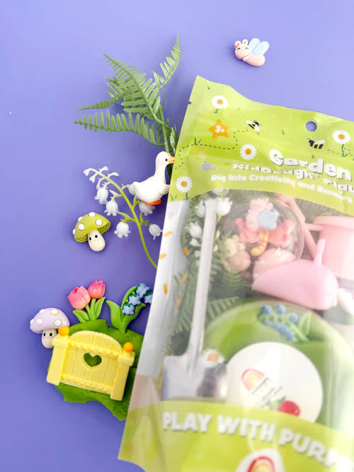 Resealable Garden KidDough sensory play kit pouch with garden figurines and tools displayed on pastel background for creative pretend gardening play