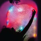 Jellystone Designs purple light up bath cubes for sensory exploration
