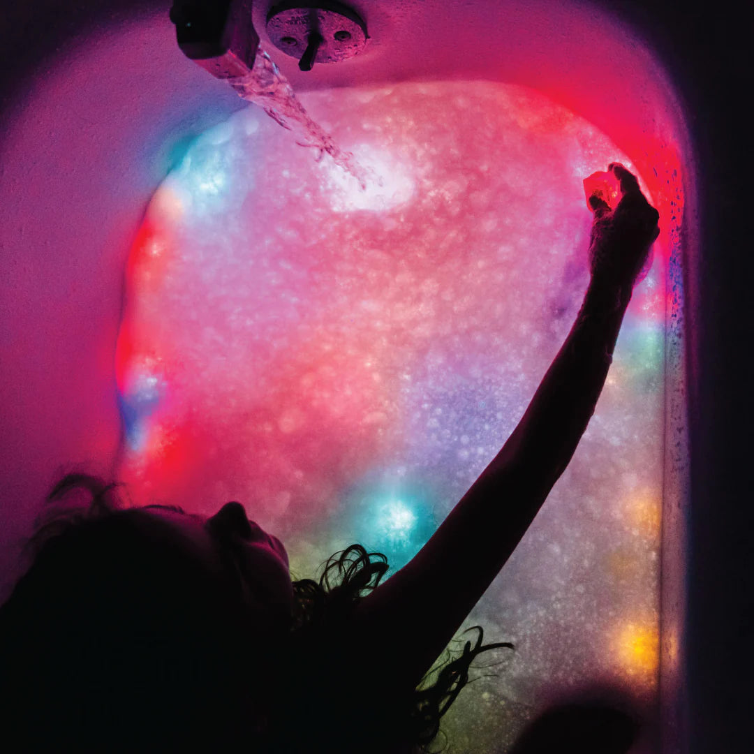 Jellystone Designs purple light up bath cubes for sensory exploration
