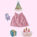 olli ella Pink birthday dress with accessories including a unicorn toy, gift box, and birthday cake for dinkum dolls