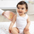 Baby using soft sun design bath mitt during bath time or playtime
