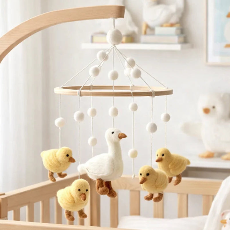 Mama Duck and Ducklings Felt Baby Mobile by Ganapati with handmade wool felt ducks hanging from wooden frame