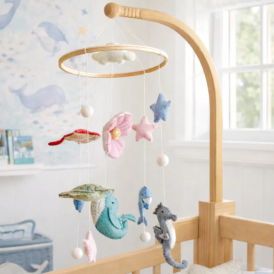 Sea Life Felt Baby Mobile by Ganapati with handmade wool felt ocean animals hanging from wooden frame