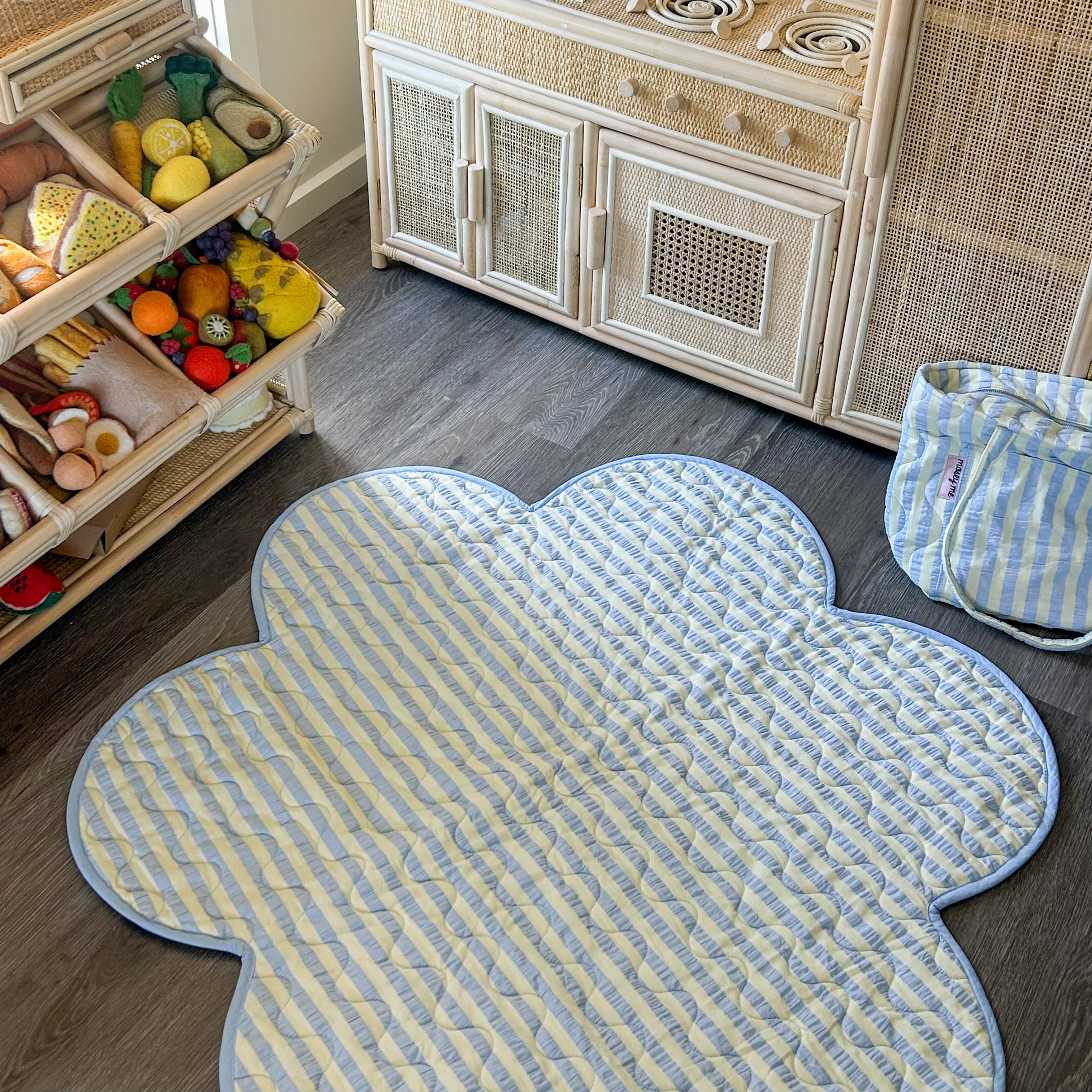 blue and yellow striped flower playmat mosey me