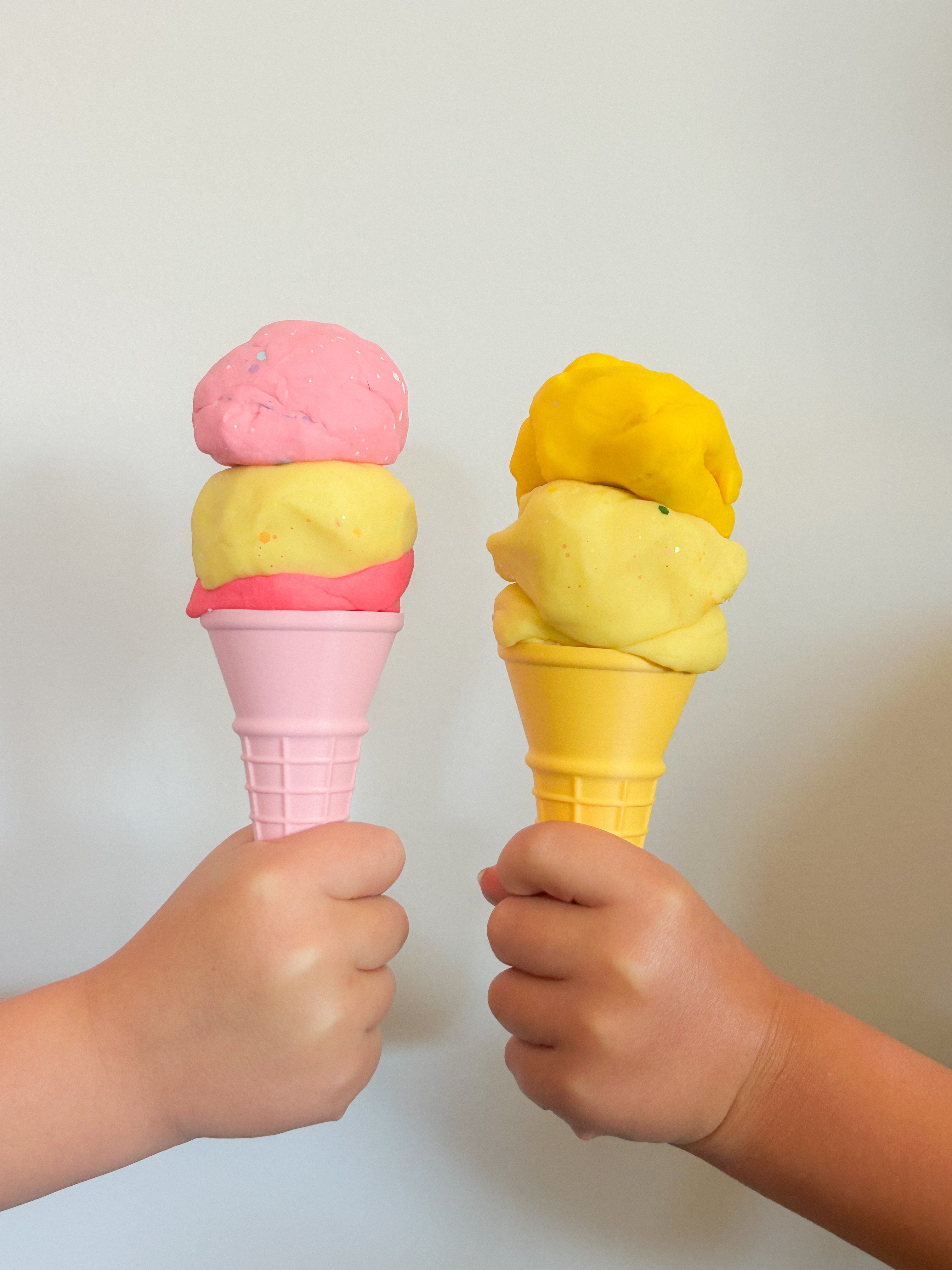 showing how to use colourful rainbow 3d printed eco ice cream cone for sensory play with clay, playdough, dough and more. brand is playsense. these are fun for kids. pictures is colours yellow and pink