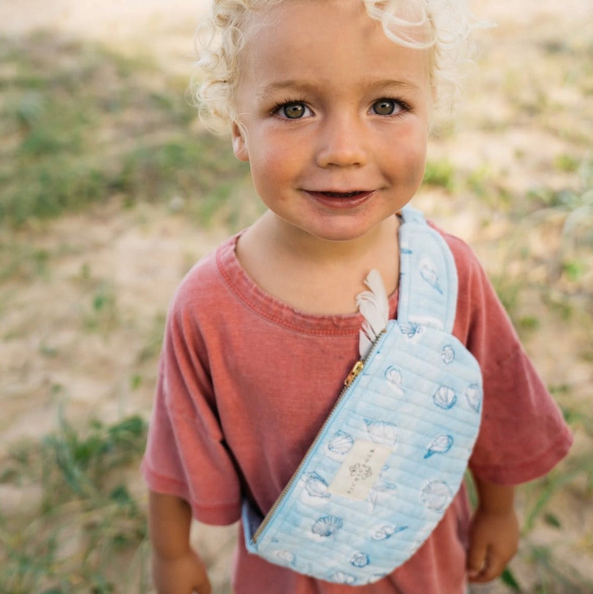 collecting treasures at beach in picnic folk crossbody kids bag