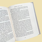 inside of Grimm’s Fairy Tales collector’s edition hardback book with illustrated cover and gold foil lettering featuring classic fairytale stories