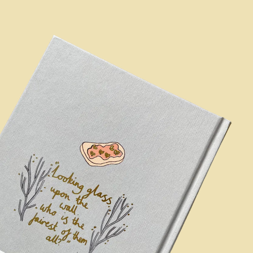 back of Grimm’s Fairy Tales collector’s edition hardback book with illustrated cover and gold foil lettering featuring classic fairytale stories