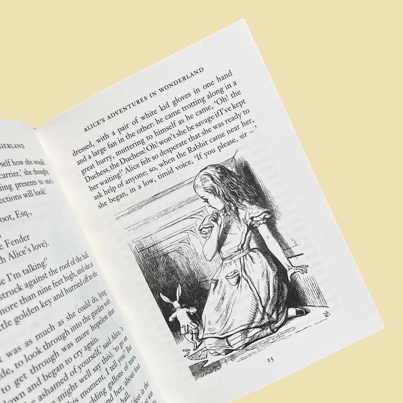 inside of Alice in Wonderland collector’s edition hardback book with blush pink illustrated cover, gold foil lettering and sprayed heart cards page edges by Lewis Carroll. wordsworth collectors limited edition
