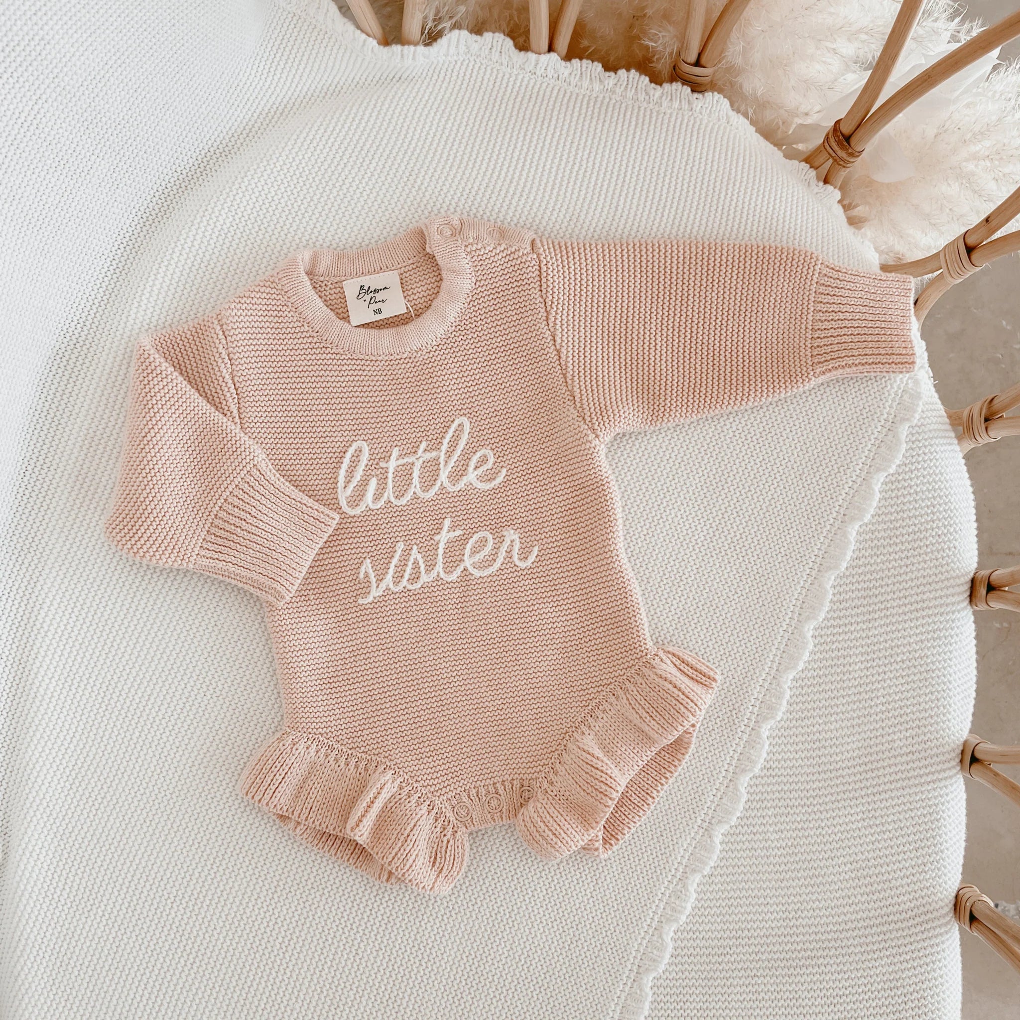 Pink Lemonade long sleeve frill knit romper by Blossom and Pear for babies