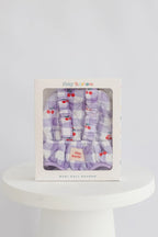 baby dolls carrier made by tiny harlow in packaging to show good for gifting and pretend play, the print is cherry gingham