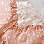 Posy heirloom frill knit baby blanket by Blossom and Pear in soft blush floral knit