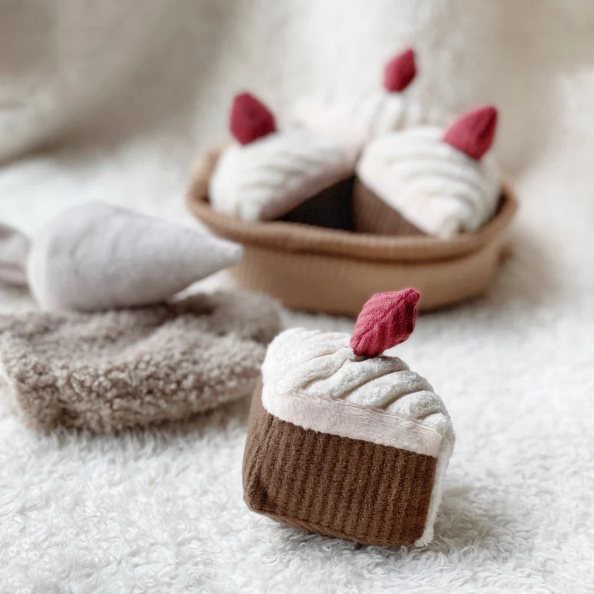 Child enjoying imaginative play with the Little Lamb Kind cake baking pretend play set
