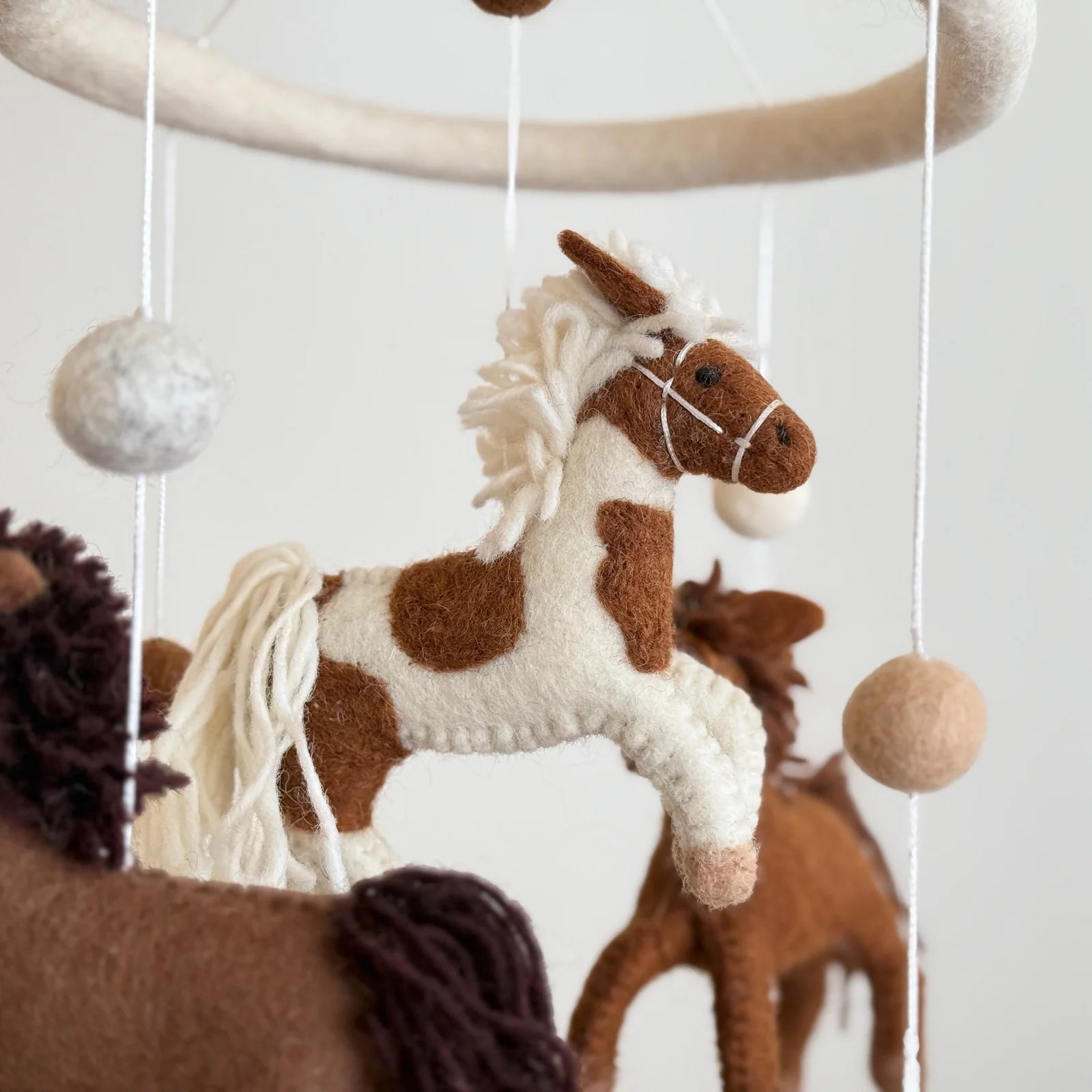 Equestrian nursery baby mobile with handmade felt horses and wooden hanging frame