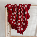 Red Posy heirloom frill knit baby blanket by Blossom and Pear with floral knit detailing