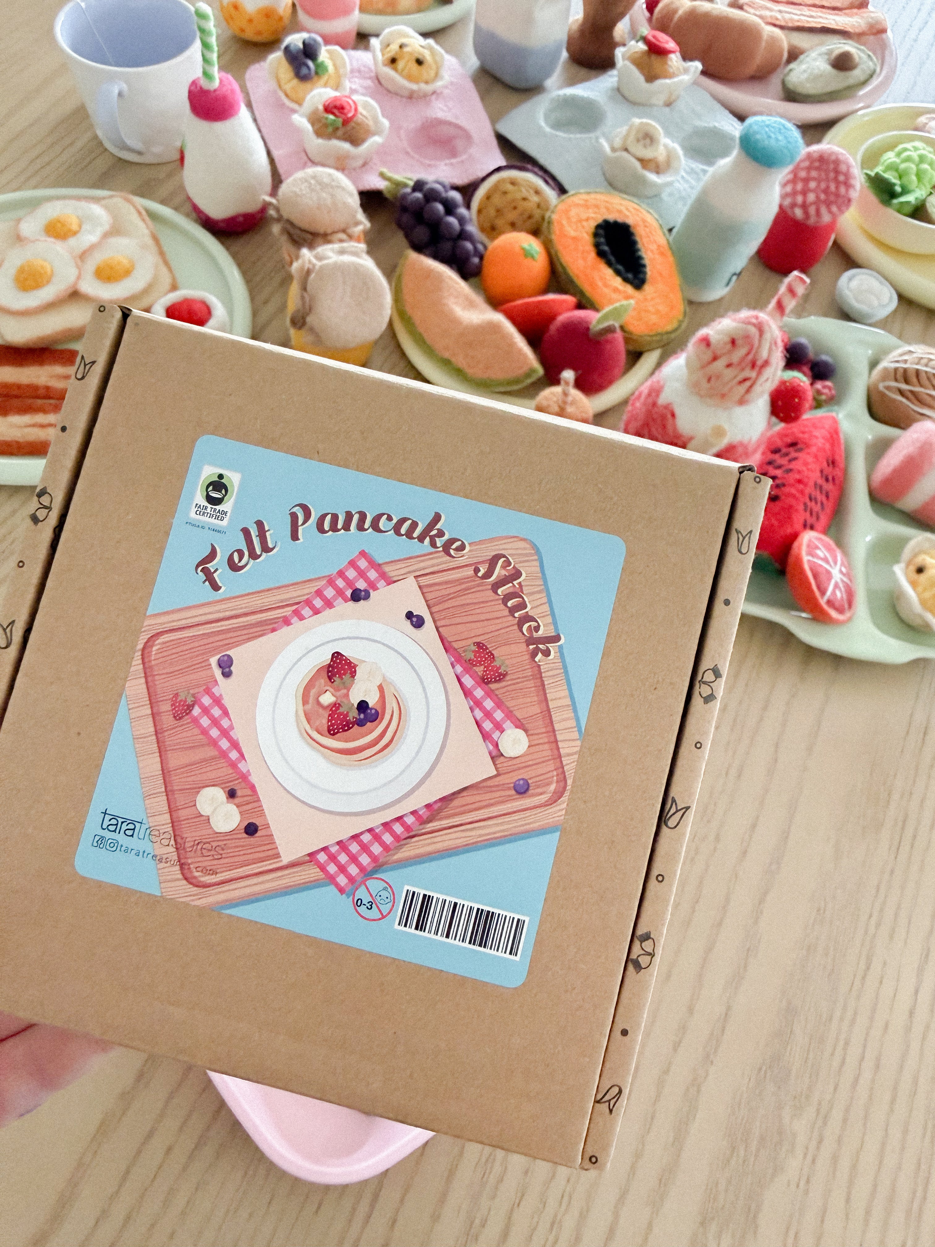 box packaging of felt pancake stack toy set handmade wool pretend play food with berries and banana Tara Treasures