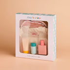 packaged up for gifting the tiny harlow bath accessory pack that comes with a bag, body lotion,baby doll towel, baby powder and bubble bath all for pretend play with dolls called tiny bath time
