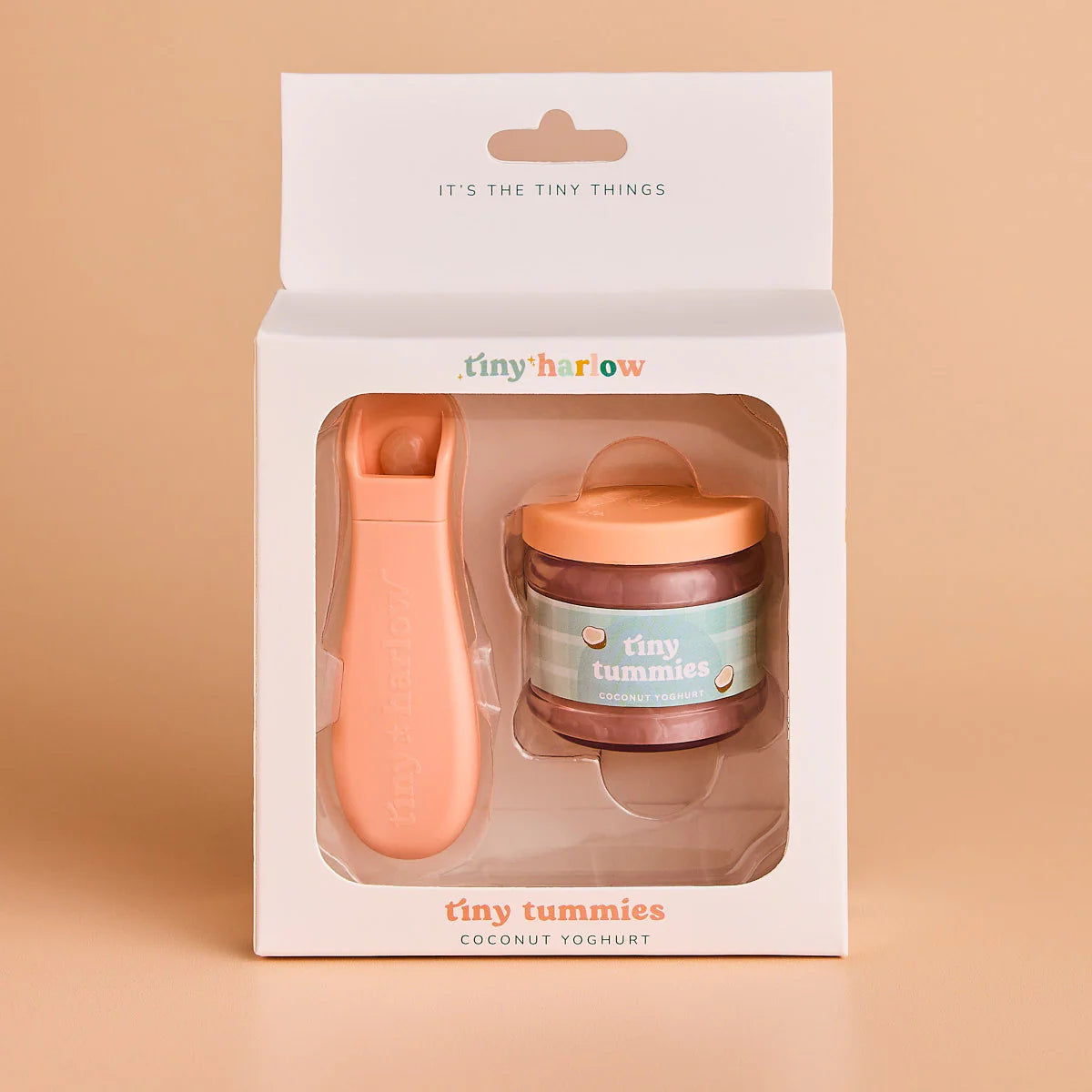 packaging of jar of tiny tummies pretend baby dolls food which is magic and disappearing, perfect gifting brand is tiny harlow and flavour is coconut yoghurt