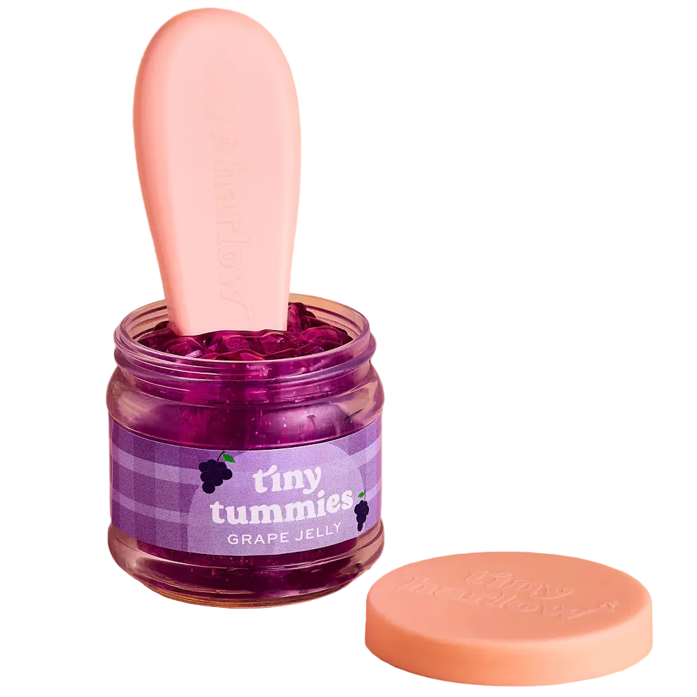jar of tiny tummies pretend baby dolls food which is magic and disappearing, brand is tiny harlow and flavour is grape jelly
