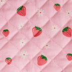 close up of fabric by brand tiny harlow - print is  strawberry picnic