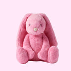 Pink plush bunny toy on a white background