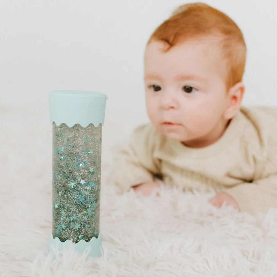 Soft mint baby calm down sensory bottle with stars and shimmering glitter by Jellystone Designs