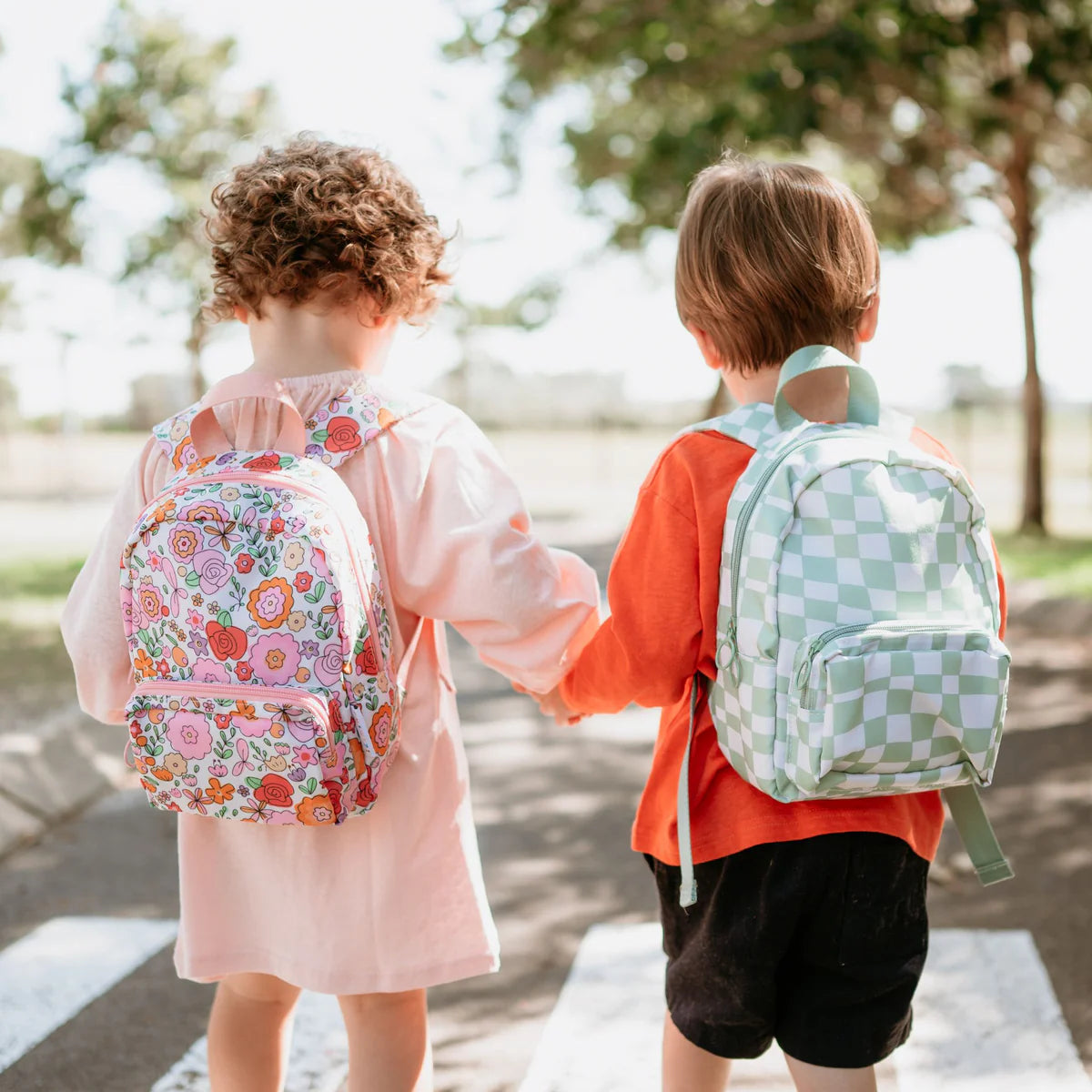 two children outside photoshoot toddler backpacks, perfect for on the go and have matching accessories. can also be personalised with childs name. this print is parker and paloma