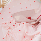 Pink baby cot sheet with heart pattern soft stretchy fabric
