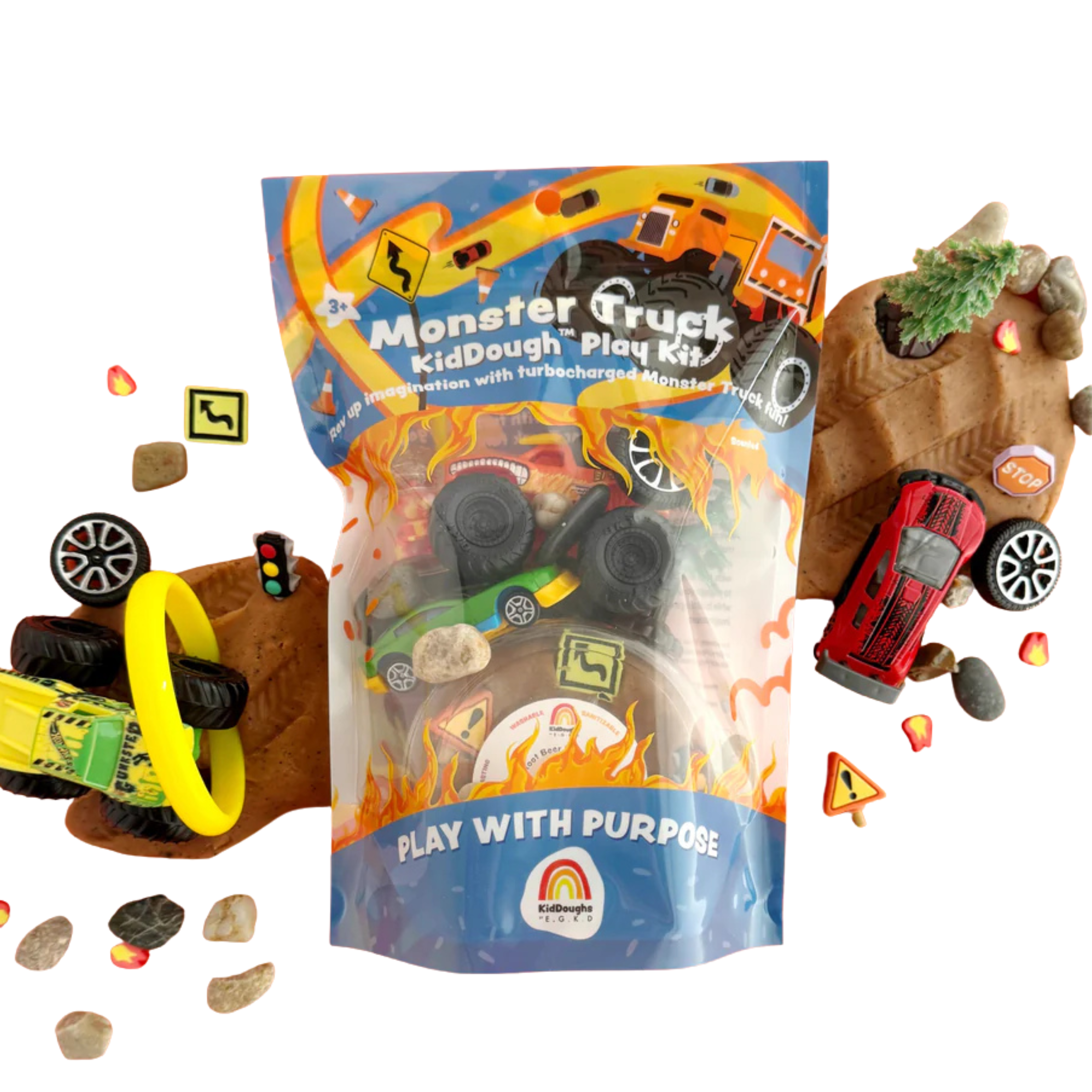Monster truck sensory playdough kit with brown scented KidDough, toy trucks, tyres, rocks and road signs arranged for kids construction and vehicle themed play