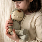 Close up of Pickle Dozy Dinkum doll face and soft fabric